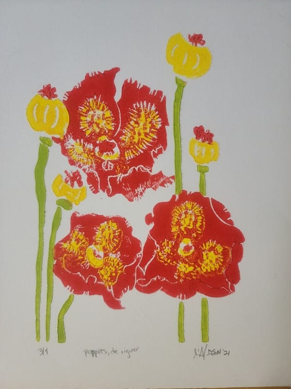 Woodcut relief print of three red poppies with yellow centers